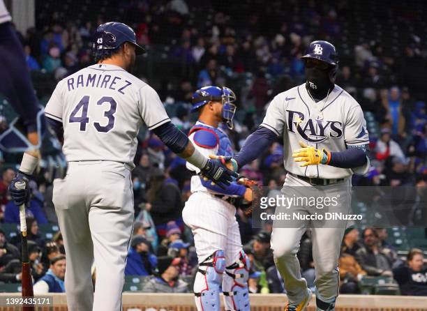 Wander Franco of the Tampa Bay Rays is congratulated by Harold Ramirez following Franco's two-run home run during the third inning against the...
