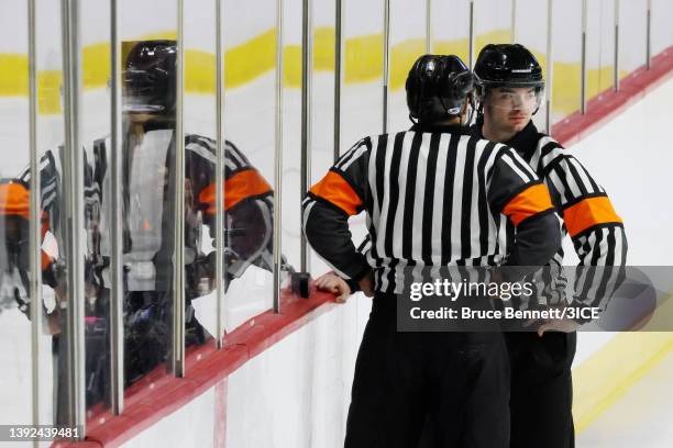 Referees discuss a play during a 3ICE Hockey tryout session at the Orleans Arena on April 19, 2022 in Las Vegas, Nevada.