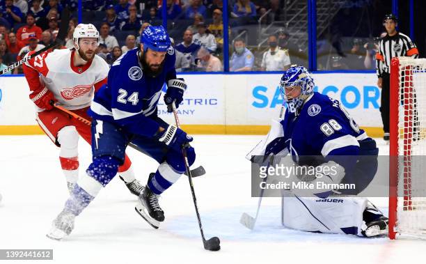 Zach Bogosian of the Tampa Bay Lightning looks to pass during a game against the Detroit Red Wings at Amalie Arena on April 19, 2022 in Tampa,...