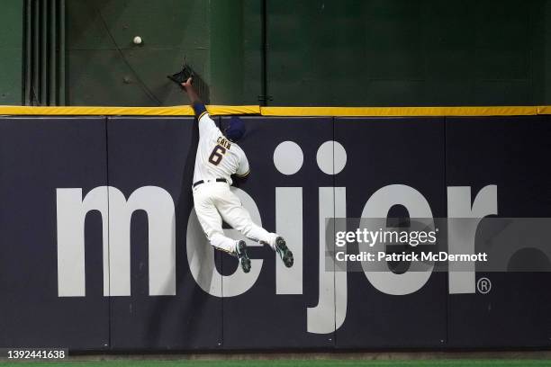 Lorenzo Cain of the Milwaukee Brewers is unable to catch a solo home run hit by Josh VanMeter of the Pittsburgh Pirates in the seventh inning at...