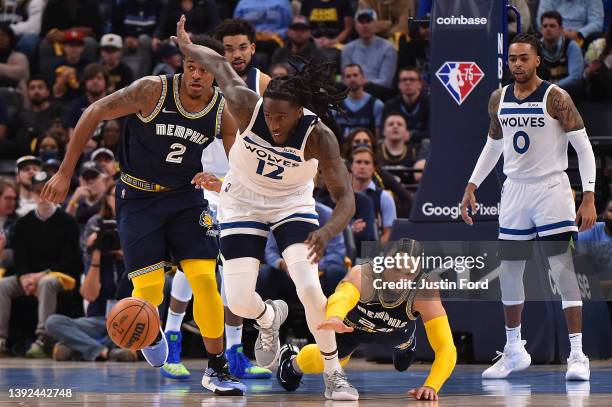 Taurean Prince of the Minnesota Timberwolves and Dillon Brooks of the Memphis Grizzlies fight for the ball during Game Two of the Western Conference...