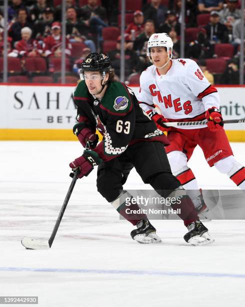 Matias Maccelli of the Arizona Coyotes skates with the puck against the Carolina Hurricanes at Gila River Arena on April 18, 2022 in Glendale,...