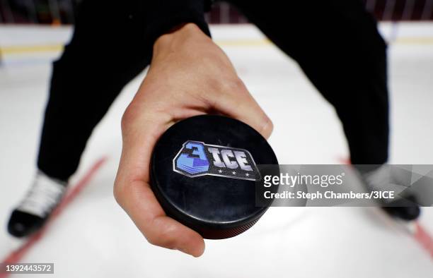 Referee holds a 3ICE puck during a 3ICE Hockey tryout session at the Orleans Arena on April 19, 2022 in Las Vegas, Nevada.