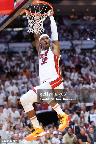 Jimmy Butler of the Miami Heat celebrates a dunk against the Atlanta Hawks during the second half in Game Two of the Eastern Conference First Round...