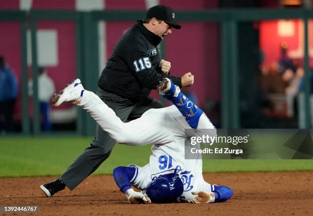 Andrew Benintendi of the Kansas City Royals is called out by umpire Junior Valentine after being tagged out by Carlos Correa of the Minnesota Twins...