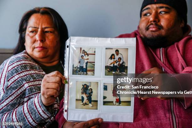 From left, Yojana Paiz and her son Pedro Ciria hold photos of Joaquin Ciria as they visited in prison in San Francisco, Calif. On Sunday, April 17,...