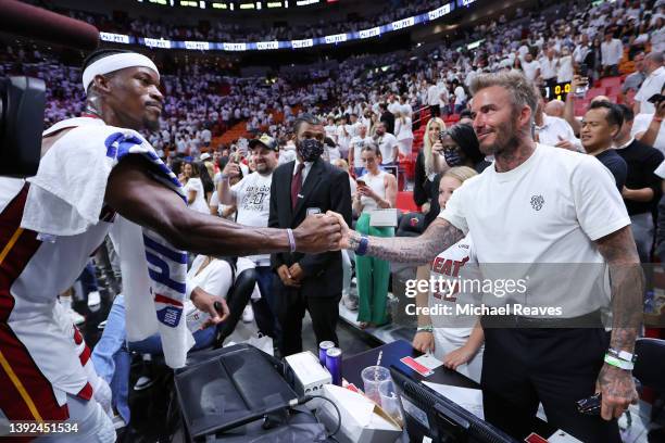 Jimmy Butler of the Miami Heat greets president & co-owner of Inter Miami CF David Beckham after Game Two of the Eastern Conference First Round...