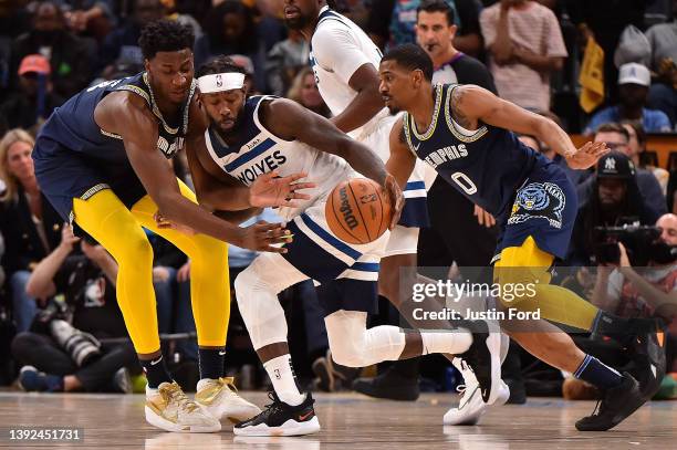 Patrick Beverley of the Minnesota Timberwolves handles the ball against Jaren Jackson Jr. #13 of the Memphis Grizzlies during Game Two of the Western...