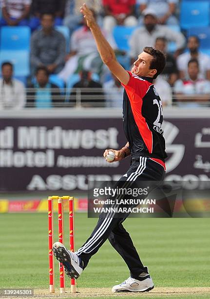 England's Steven Finn delivers the ball during the third One Day International match between Pakistan and England at the Dubai International cricket...