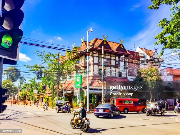 an intersection in the old town of chiang mai, thailand - chiang mai stock pictures, royalty-free photos & images