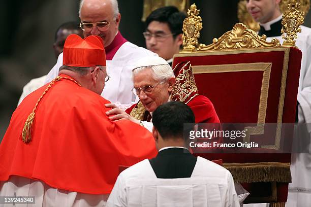 New cardinal Timothy Michael Dolan , Archbishop of New York, receives the biretta cap from Pope Benedict XVI in Saint Peter's Basilica on February...