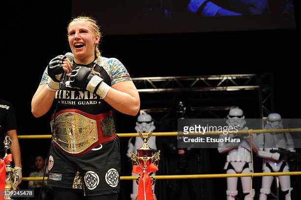 Amanda Lucas, daughter of film director Goerge Lucas, new DEEP women's open weight champion looks on with STAR WARS's character Darth Vader and Storm...