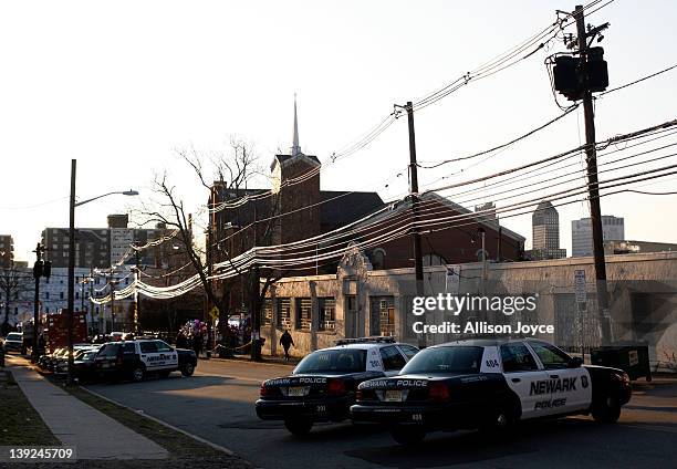 Police are seen near the scene of Whitney Houston's funeral at New Hope Baptist Church on February 18, 2012 in Newark, New Jersey. Whitney Houston...