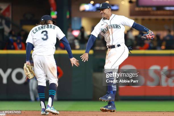 Crawford and Julio Rodriguez of the Seattle Mariners celebrate after the 6-2 win against the Texas Rangers at T-Mobile Park on April 19, 2022 in...