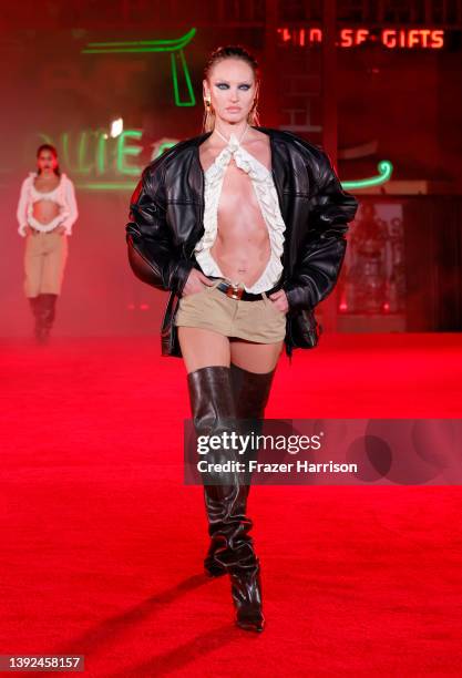 Model Candice Swanepoel walks the runway during the Alexander Wang "Fortune City" Runway Show on April 19, 2022 in Los Angeles, California.