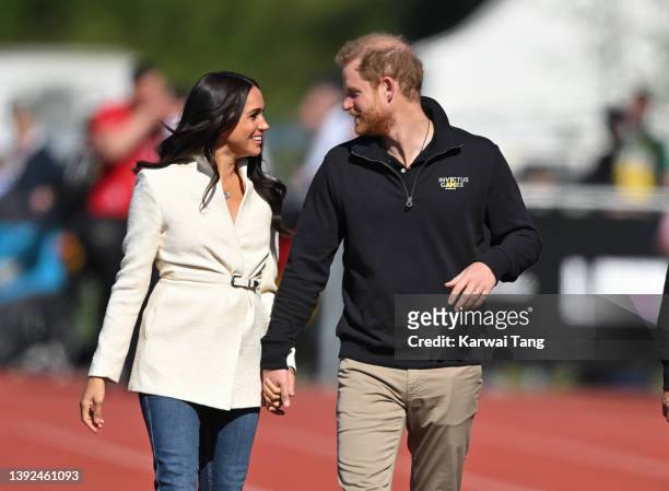 Prince Harry, Duke of Sussex and Meghan, Duchess of Sussex attend the athletics event during the Invictus Games at Zuiderpark on April 17, 2022 in...