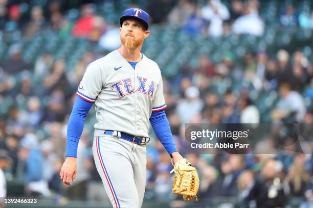 Jon Gray of the Texas Rangers reacts after the first inning against the Seattle Mariners at T-Mobile Park on April 19, 2022 in Seattle, Washington.