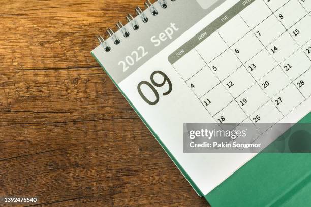 top views calendar desk 2022 september is the month for the organizer to plan and remind on the wooden table background. - september imagens e fotografias de stock