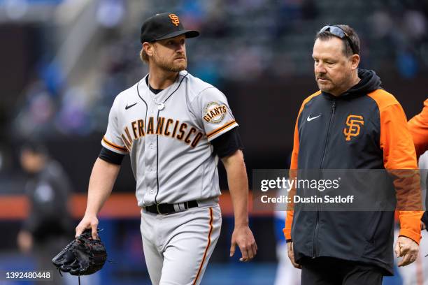 Alex Cobb of the San Francisco Giants walks back to the dugout after being removed from the game in the fifth inning against the New York Mets at...