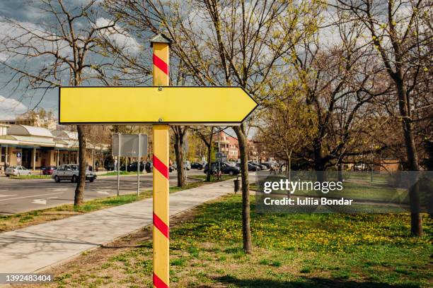 empty sign on a road with copy space - pointer stick stock pictures, royalty-free photos & images