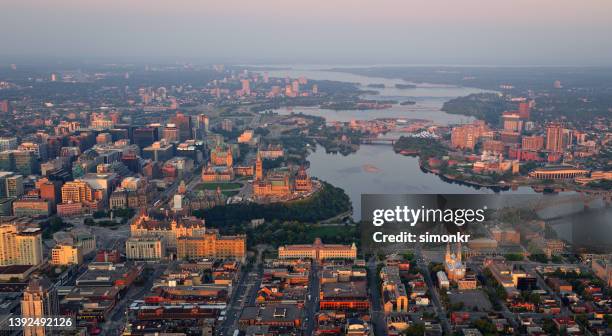 downtown ottawa and ottawa river - ottawa parliament building stock pictures, royalty-free photos & images