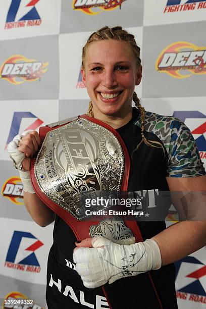Amanda Lucas, daughter of film director George Lucas and the new DEEP woman's open weight champion poses with the belt in her post match media...