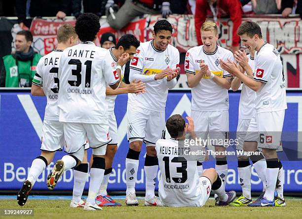 Players of Moenchengladbach celebrates after Roman Neustaedter is scoring his teams first goal during the Bundesliga match between 1.FC...