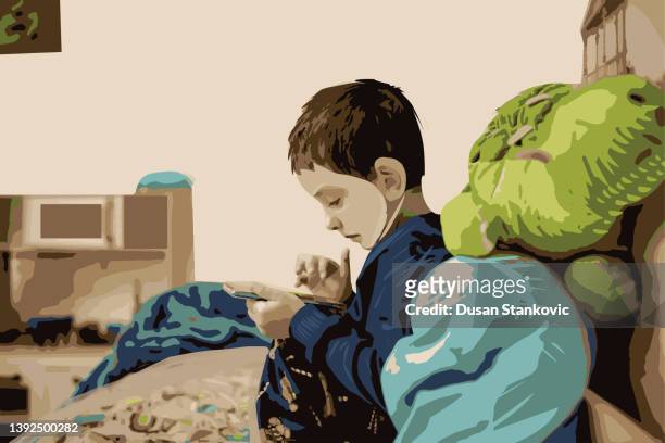 cute little child watching video game - children playing video games on sofa stock illustrations