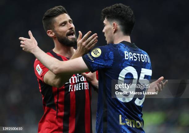 Olivier Giroud of AC Milan disputes with Alessandro Bastoni of FC Internazionale during the Coppa Italia Semi Final 2nd Leg match between FC...