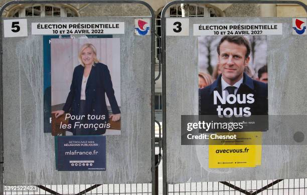 Official campaign posters of Marine Le Pen, leader of the far-right Rassemblement national party and French President Emmanuel Macron 'La République...