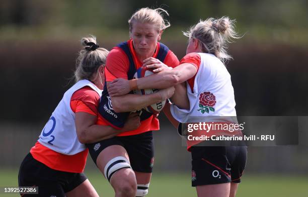 Alex Matthews of England is tackled during a Red Roses training session at Bisham Abbey on April 20, 2022 in Marlow, England.