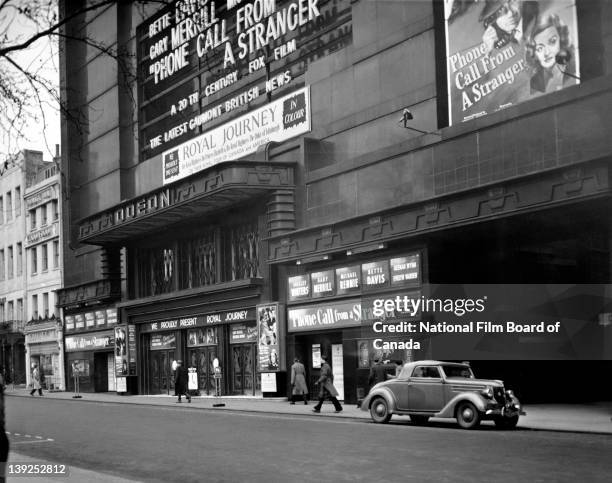 Exterior view of the Odeon Theatre in Leicester Square where the NFB film 'Royal Journey' is being shown, London, England, 1952. Photo taken during...