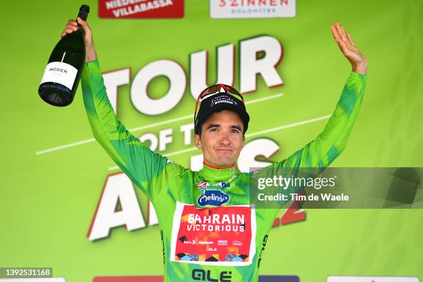 Pello Bilbao López De Armentia of Spain and Team Bahrain Victorious celebrates winning the green leader jersey on the podium ceremony after the 45th...