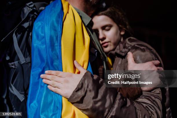 ukrainian girl saying goodbye to he father due to russian invasion in ukraine. - ukraine people stock pictures, royalty-free photos & images