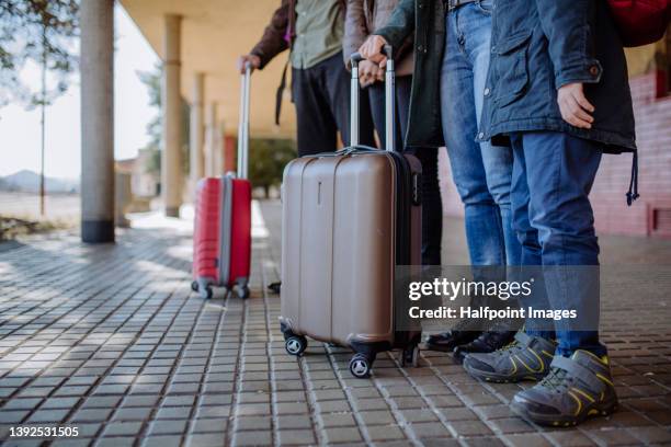 low section of ukrainian refugee family in station waiting to leave ukraine due to the russian invasion of ukraine. - displaced people fotografías e imágenes de stock