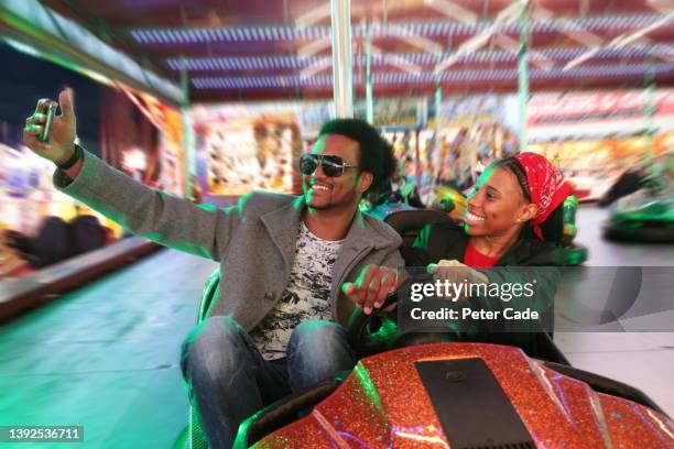 mixed race couple in dodgem car - crashes plymouth stock pictures, royalty-free photos & images