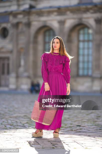 Maria Rosaria Rizzo @lacoquetteitalienne wears a gold large snake pattern necklace, a matching gold snake print pattern bracelet, a purple high neck...