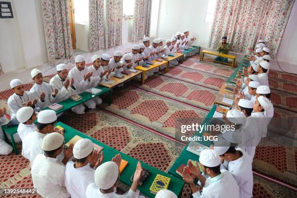 Kashmiri muslim students of a Madrasa, Islamic religious school, pray during the month of Ramadan in Srinagar, Kashmir. Muslims around the world...