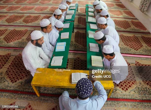 Kashmiri Muslim students of a Madrasa, Islamic religious school, recite the holy Koran during the month of Ramadan in Srinagar, Kashmir. Muslims...