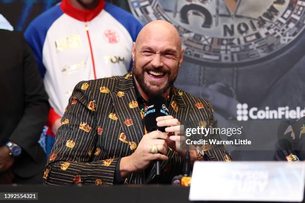 Tyson Fury reacts during a press conference ahead of the heavyweight boxing match between Tyson Fury and Dillian Whyte at Wembley Stadium on April...