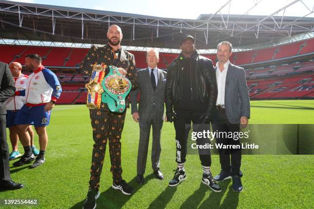 Tyson Fury, promoter Frank Warren, Dillian Whyte and Todd DuBoef, President of Top Rank Boxing pose for a photo during a press conference ahead of...