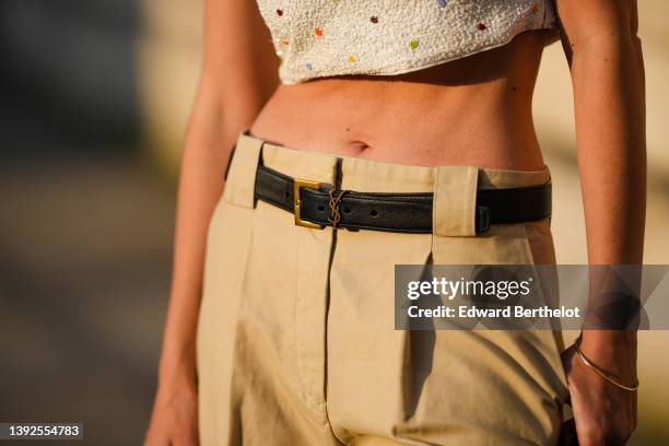 Natalia Verza @mascarada.paris wears a white latte with embroidered multicolored polka dots pattern square-neck / cropped tank-top, high waist beige...