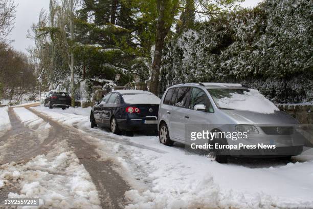 Several vehicles with a layer of snow, on 20 April, 2022 in Navacerrada, Madrid, Spain. Madrid has activated the Winter Inclement Plan for snow, rain...