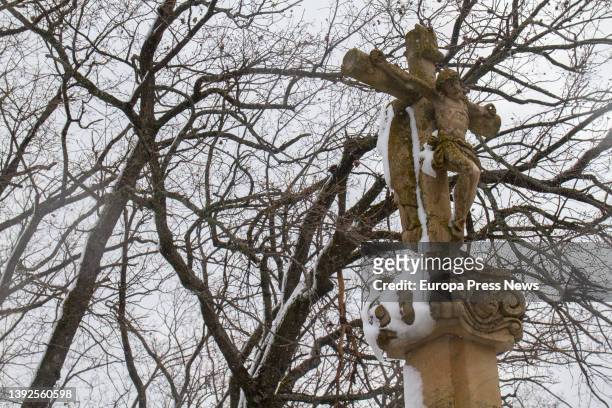 Snow-covered christ in Navacerrada, on 20 April, 2022 in Navacerrada, Madrid, Spain. Madrid has activated the Winter Inclement Plan for snow, rain...