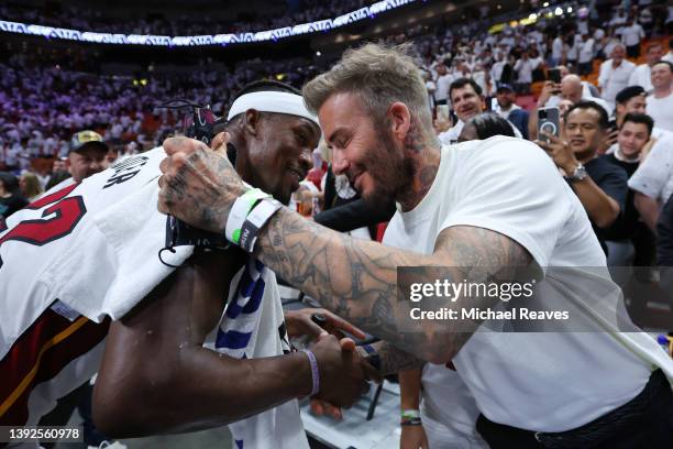 Jimmy Butler of the Miami Heat greets president & co-owner of Inter Miami CF David Beckham after Game Two of the Eastern Conference First Round...