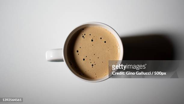 coffee mug with top view,close-up of coffee cup on white background - espresso stock pictures, royalty-free photos & images