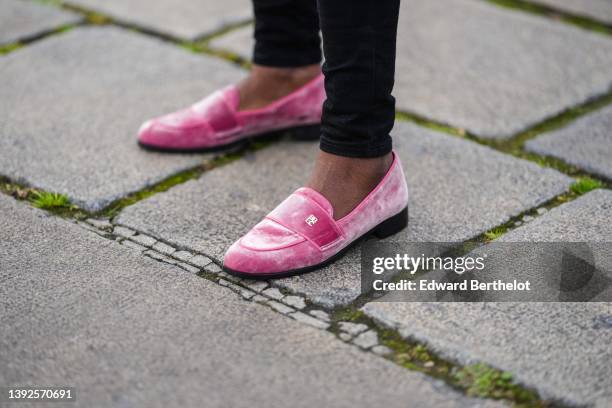 Carrole Sagba @linaose wears black denim skinny jeans pants, pink velvet loafers / shoes from BBLC, during a street style fashion photo session, on...