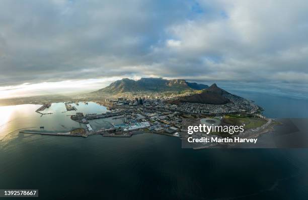 spectacular high aerial view of the iconic cape town stadium,waterfront,city centre,table mountain,lion's head,signal hill,cape town, south africa - signal hill cape town stock pictures, royalty-free photos & images