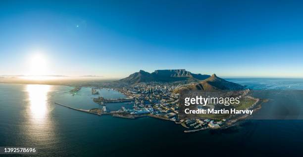 spectacular high aerial view of the iconic cape town stadium,waterfront,city centre,table mountain,lion's head,signal hill,cape town, south africa - cape town stadium stockfoto's en -beelden