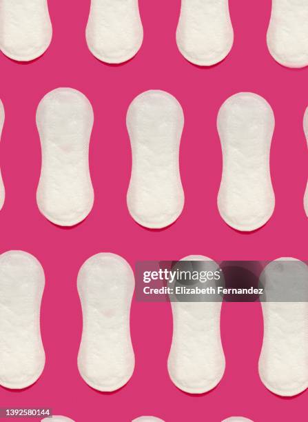 seamless pattern of sanitary pad on pink background - damenbinde stock-fotos und bilder